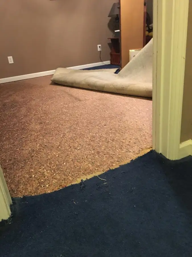 Carpet pad removal revealing water damage during Water Mitigation Services in Good Hope